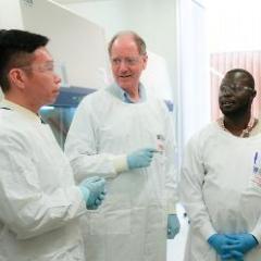Three men in lab coats